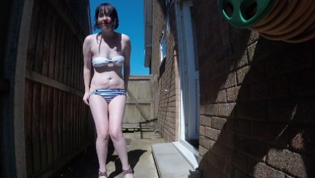 Skinny British Wife wearing retro swimwear Outdoors